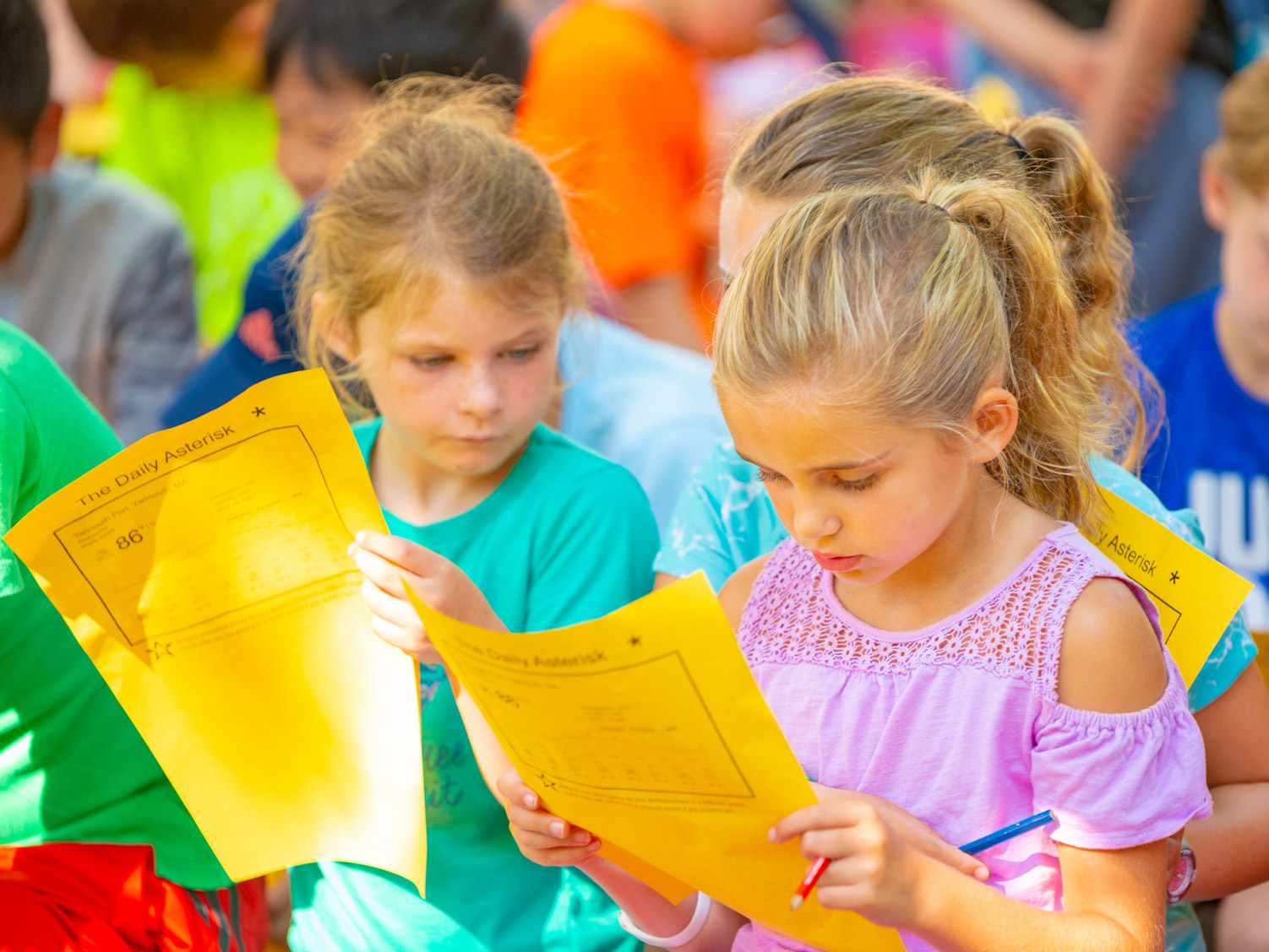 Kids filling out their daily choice activities forms