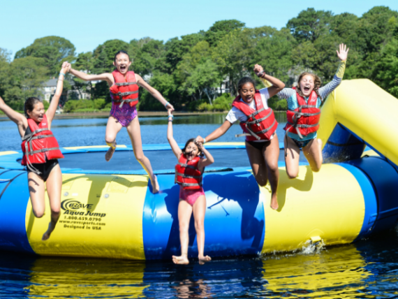 kids jumping into water