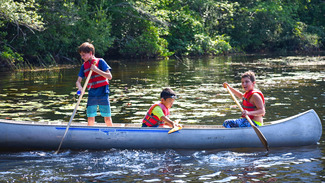 Boys canoeing in the lake