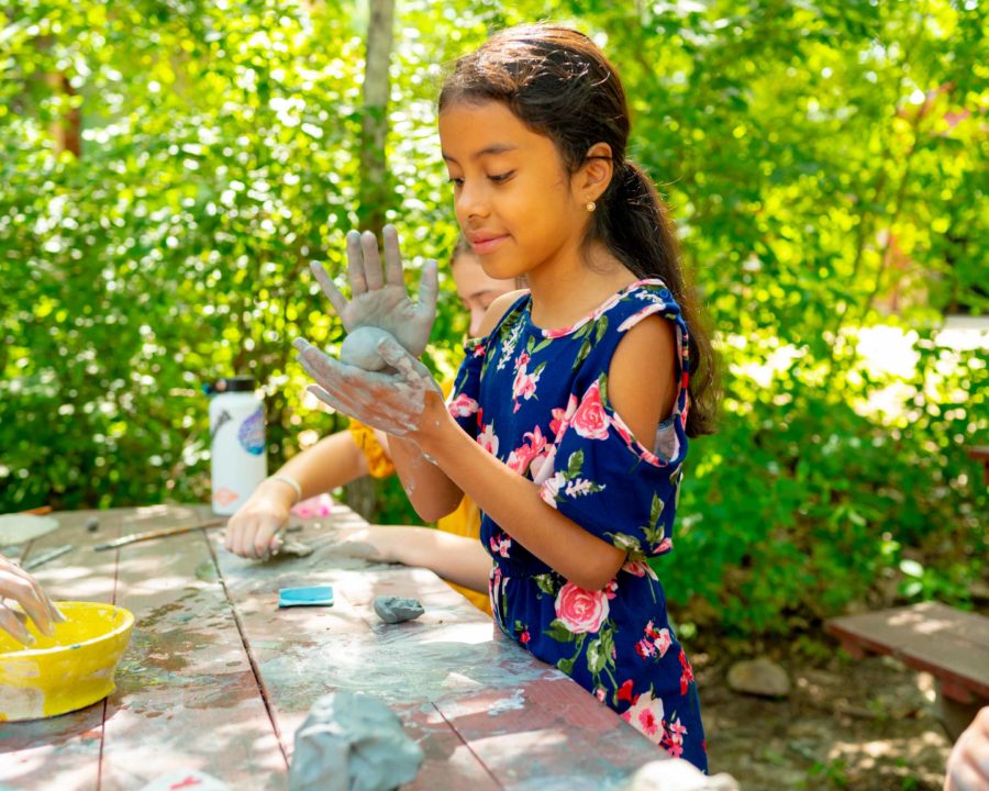 Camper playing with clay