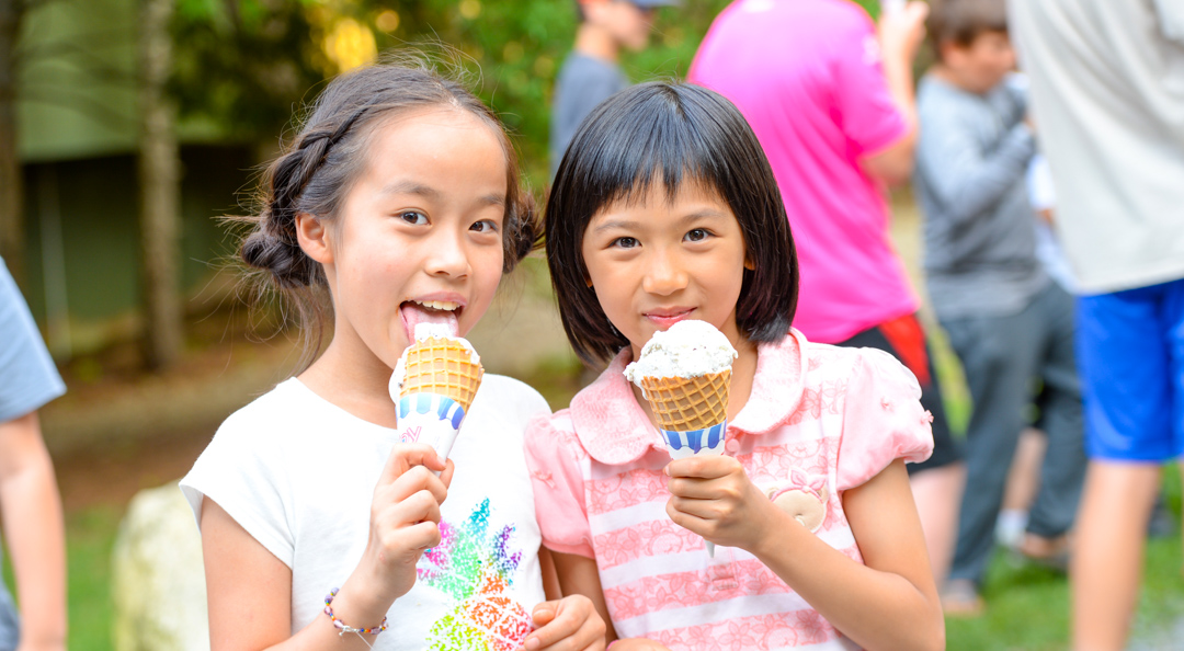 Two girls eating ice cream