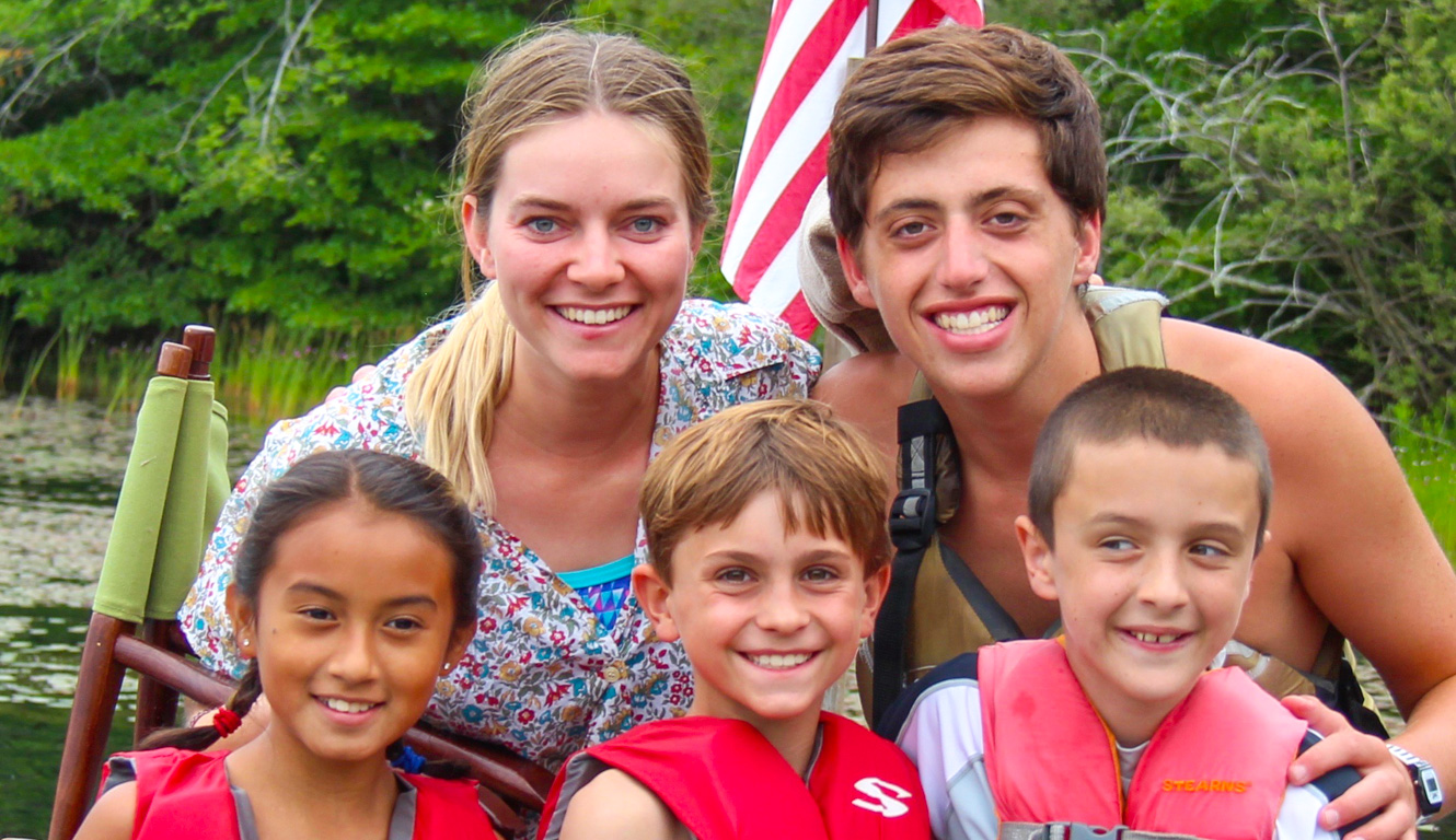 Life guards with kids in lifevests