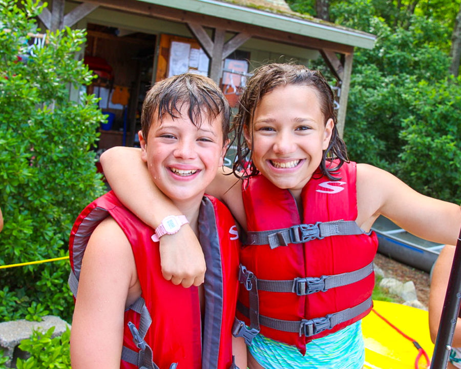 Two campers in life vests