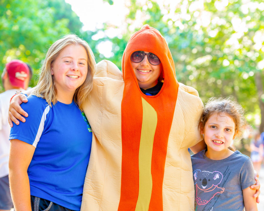 Campers with a counselor dressed in a hot dog costume